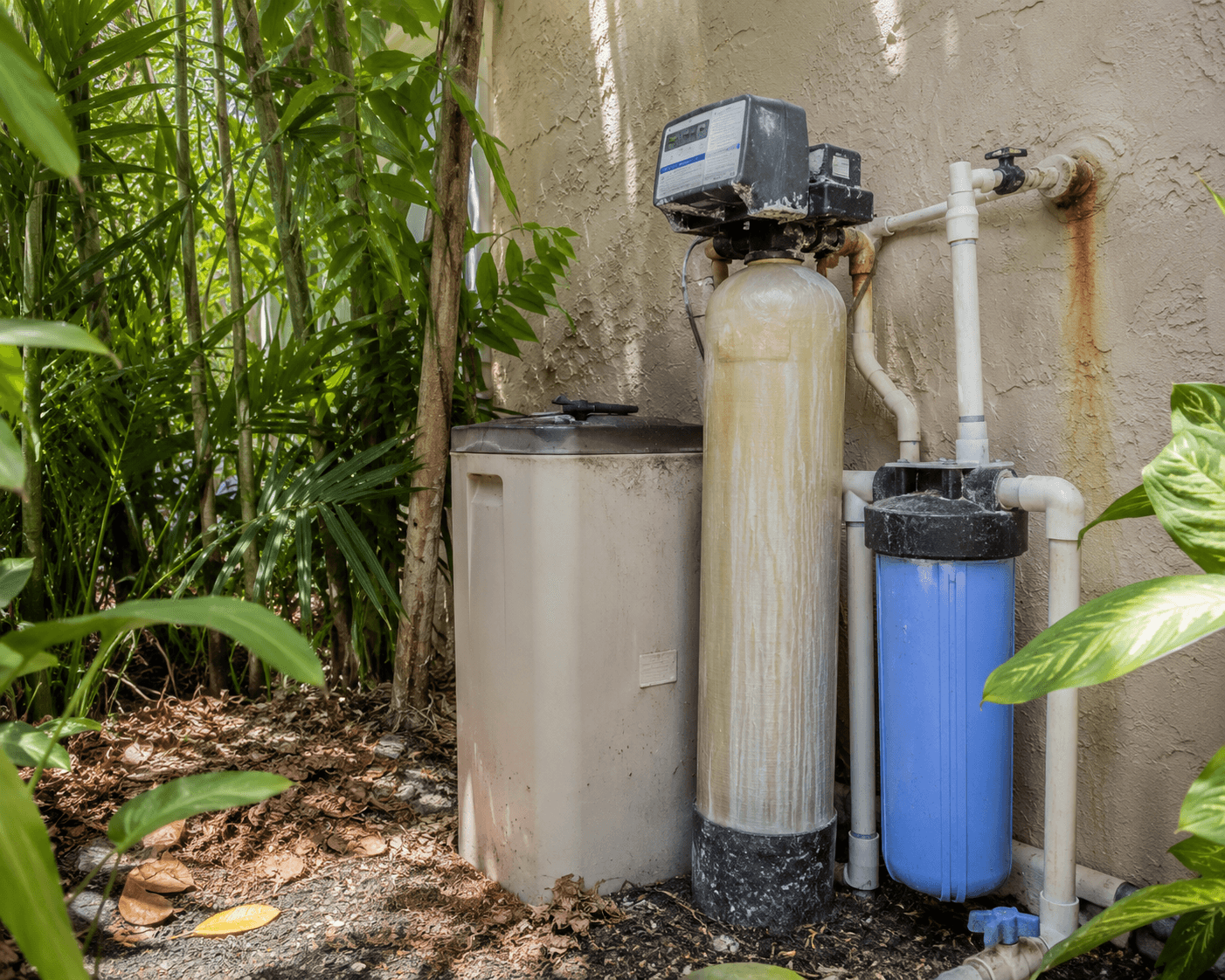 Custom white wood water system enclosure with corrugated metal roof by Benito Fine Carpentry Palm Beach County